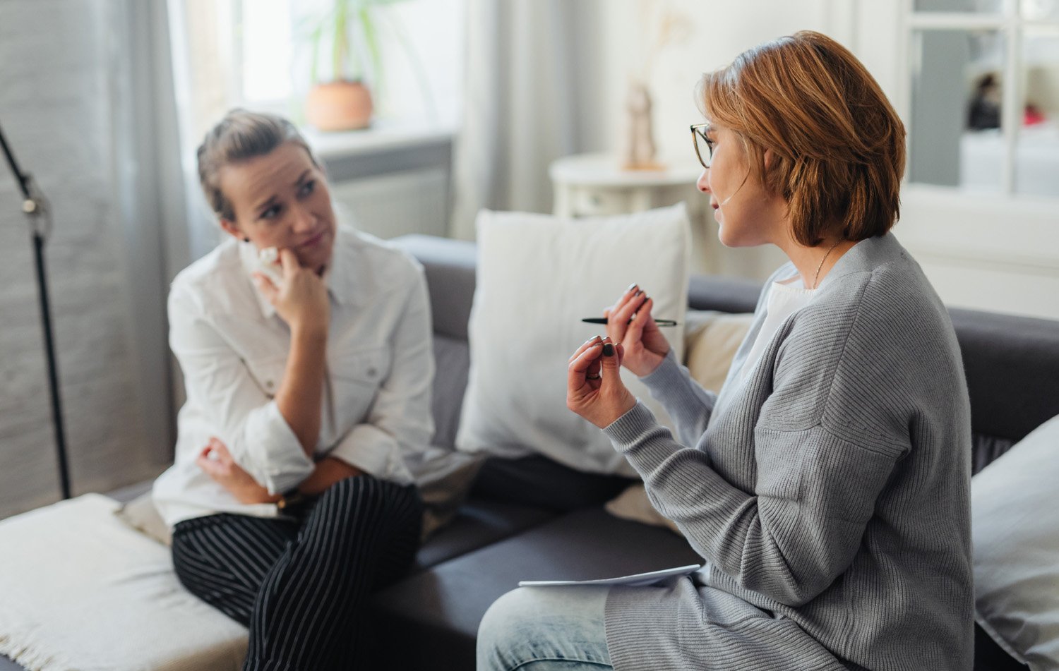 Sex therapist talks to patient in a session