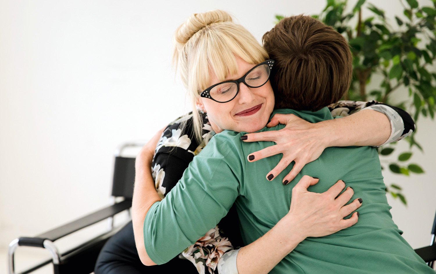 Sex Coach hugging a client after their session